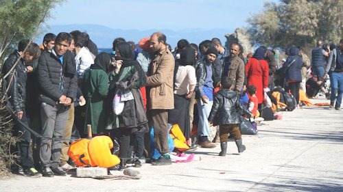 52115208 - refugees on the greek shore