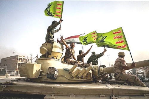 Raising_flag_of_Iraq_and_Popular_Mobilization_Forces_after_defeating_DAESH